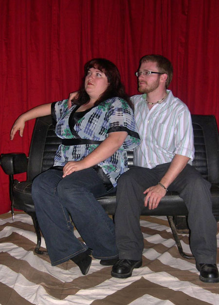 Amanda and Jared sitting in the Red Room they built.